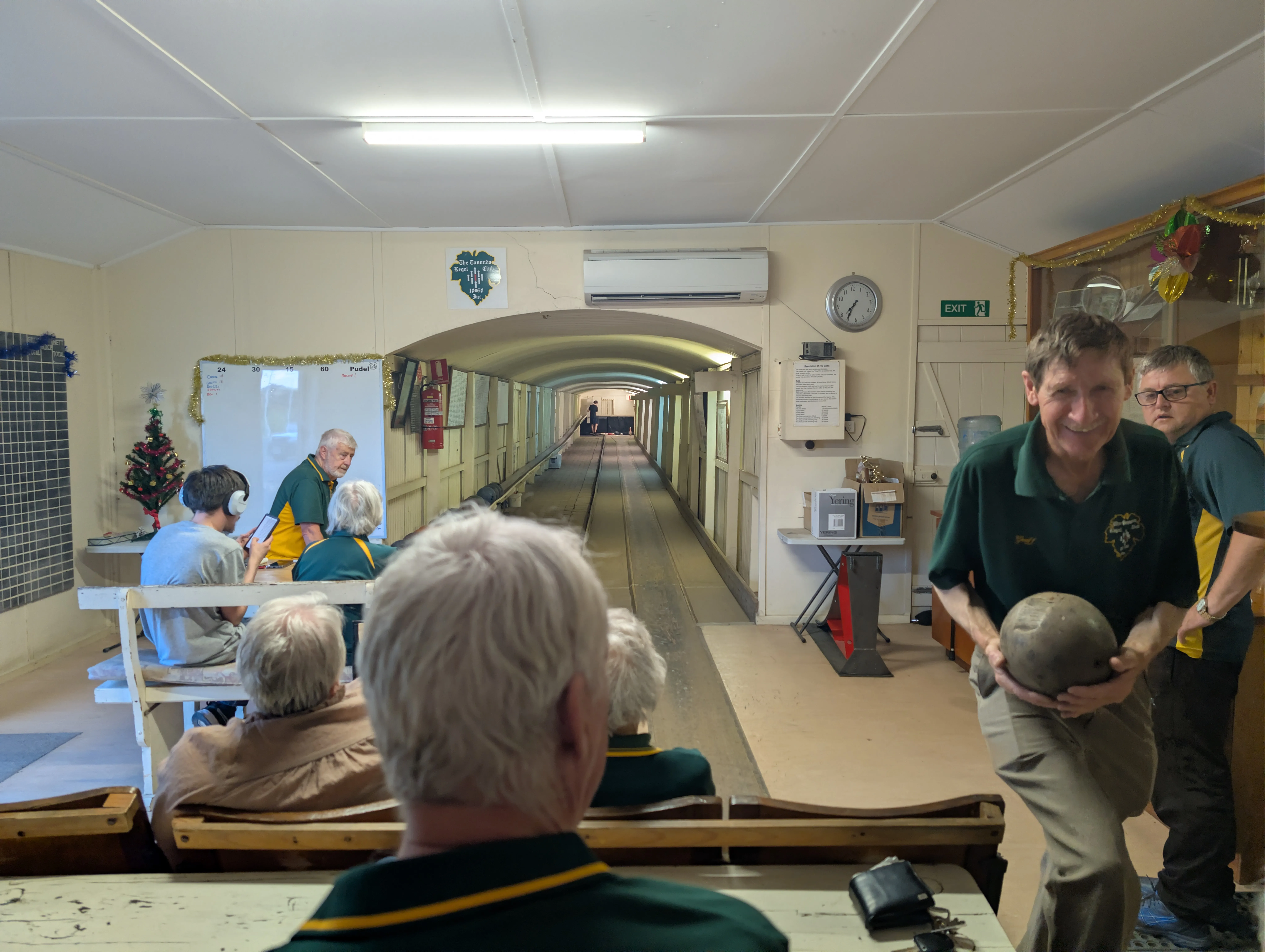 Holding the antique wooden bowling ball at the Tanunda Kegel Club